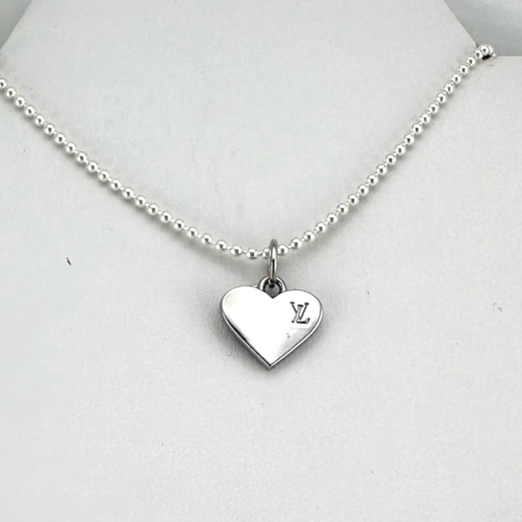 Louis Vuitton Jewelry - Louis Vuitton charm w/bonus gift. AUTHENTIC.